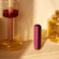 Ploom AURA Dark Orchid device standing on a table, presenting a confident and elegant color that draws attention without feeling excessive.