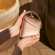 Hand holding a Rose Gold Duo Carry Case accessory, highlighting soft metallic tones, refined design, and a polished, premium feel.