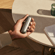 Hand holding a Ploom AURA with Lunar Silver Back Cover, feeling smooth and cool in hand, designed to fit naturally into your daily routine.
