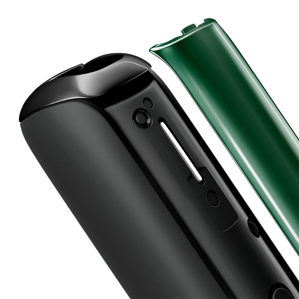 Close-up of Amazon Green Ploom AURA front panel removed, showing glossy texture, vibrant color depth, subtle reflections, and tactile premium feel.
