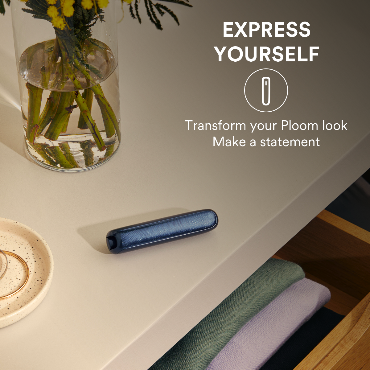 Ploom AURA device shown with a Dark Orchid front panel attached, highlighting the deep, vibrant color option designed for personal style expression.
